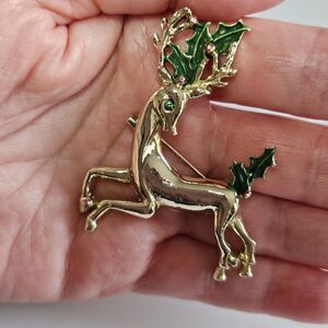 **Final Sale** Gerry's Gold Tone Leaping Reindeer Green Eye Holly Brooch Pin
